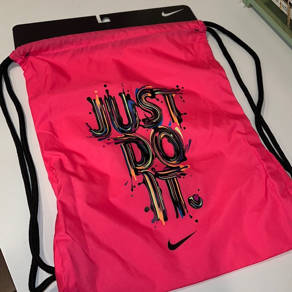 Hot pink Nike strap bag